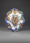 A PAIR OF MIXED TECHNIQUE POLYCHROME DELFT PLAQUES, MID 18TH CENTURY
