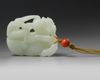 A Chinese white jade 'Buddhist lion and cubs' carving