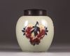 A Chinese celadon-ground 'nine peaches' ovoid jar
