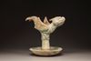 A Chinese green-glazed dragon-carp oil lamp