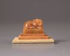 A Chinese yellow soapstone 'tiger' seal