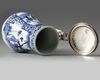 A JAPANESE BLUE AND WHITE JUG WITH SILVER COVER, 17TH CENTURY