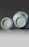 A Chinese blue and white 'floral' ovoid jar and cover