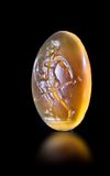 A CARNELIAN INTAGLIO SHOWING A NAKED WARRIOR, HELLENISTIC 2ND-1ST CENTURY BC