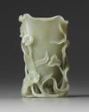 A Chinese celadon jade ‘crane and lotus’ spill vase