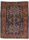 AN ANTIQUE PERSIAN HERIZ KARAJA RUG