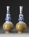 A pair of Chinese café-au-lait-glazed blue and white triple gourd vases
