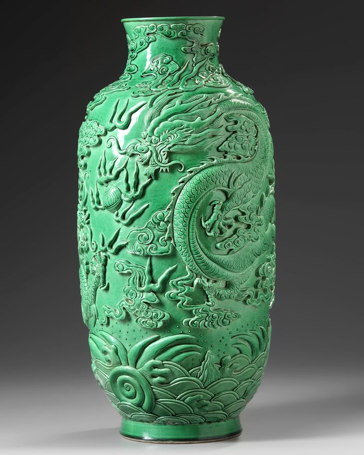 A CHINESE MOLDED GREEN GLAZED 'DRAGON' VASE