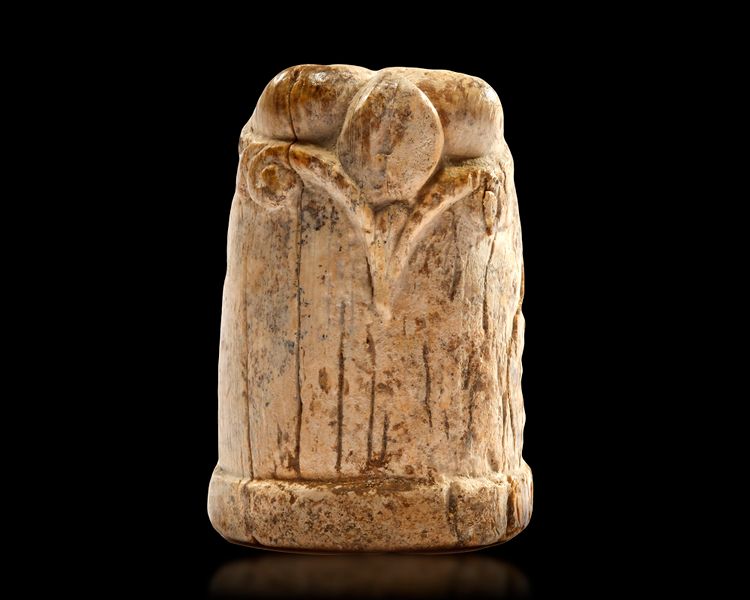 A CARVED IVORY CHESS PIECE, EGYPT OR IRAQ, 10TH-11TH CENTURY