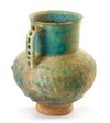 AN IRIDESCENT TURQUOISE BLUE GLAZED POTTERY JUG, KASHAN, 12TH CENTURY