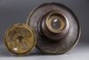 An Islamic silver inlaid brass hand wash bowl