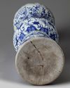 A large Chinese Ming-style blue and white 'mythical beasts' gu vase