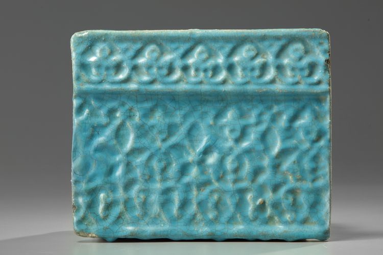 An Islamic kashan turquoise glazed tile