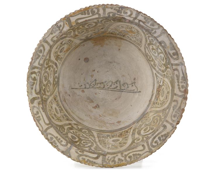 AN ABBASID UNGLAZED SLIP-PAINTED POTTERY BOWL, MESOPOTAMIA, 9TH CENTURY