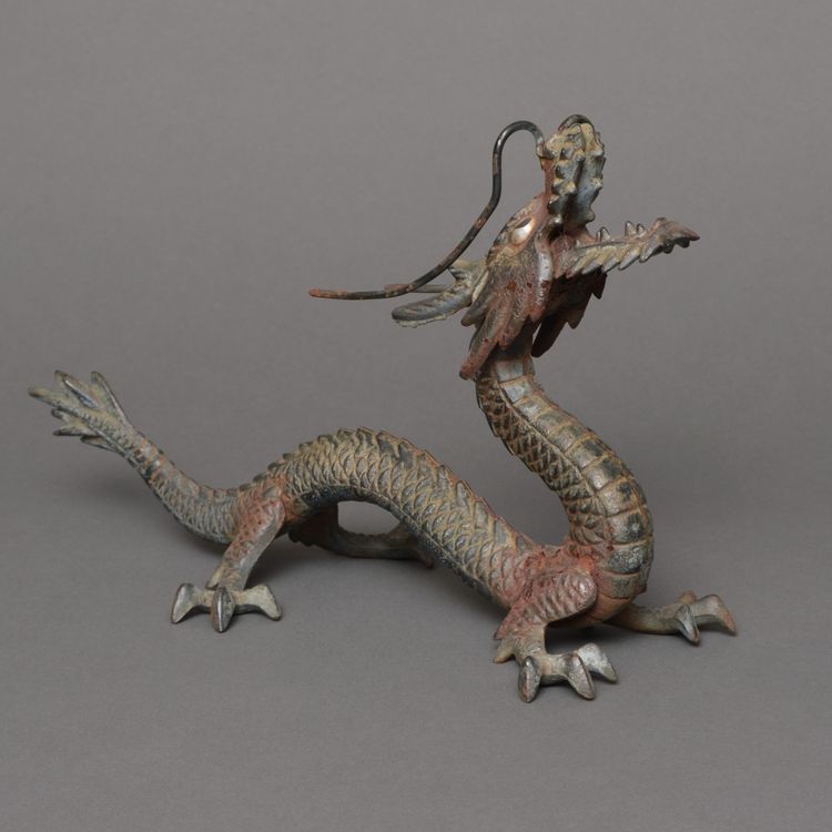 A JAPANESE CAST-IRON OKIMONO DRAGON, MID 20TH CENTURY