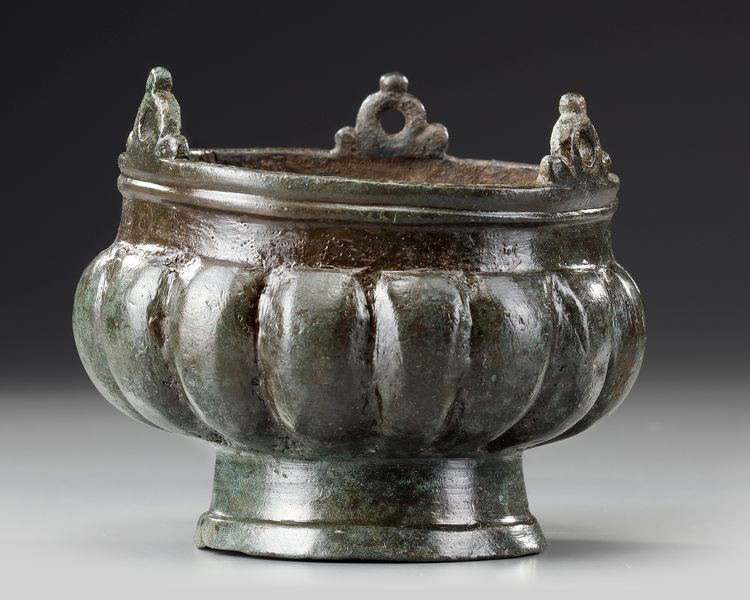 A BYZANTINE BRONZE INCENSE BURNER WITH GREEK DEDICATION, CIRCA 650-800 A.D
