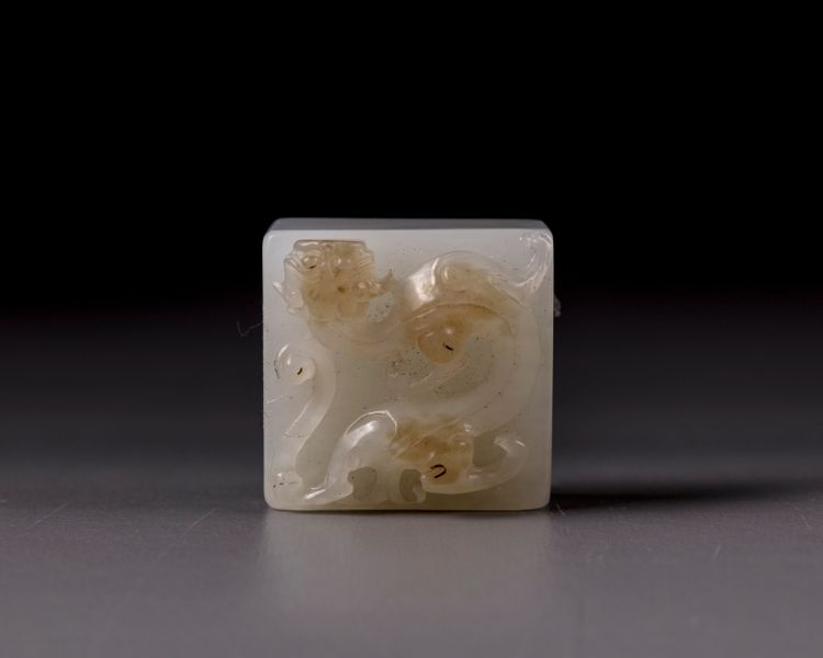 A small Chinese white jade 'chilong' seal