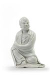 A Chinese Dehua figure of a seated Luohan