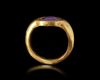 A GOLD RING WITH AN AMETHYST INTAGLIO, 4TH CENTURY AD