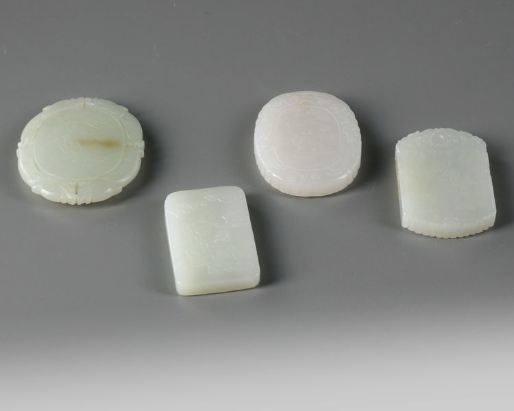 A group of four Chinese white jade plaques