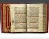 A SMALL RED LEATHER-BOUND QURAN