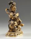 A Sino-Tibetan gilt bronze figure of Jambhala