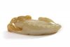 A Chinese celadon jade carving of a dog