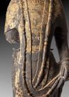 A FINELY CARVED STONE FIGURE OF A STANDING BUDDHIST DEITY