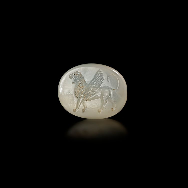 A GRECO-PERSIAN CHALCEDONY SCARABOID OF A WINGED LION – 5TH TO 4TH CENTURY B.C.