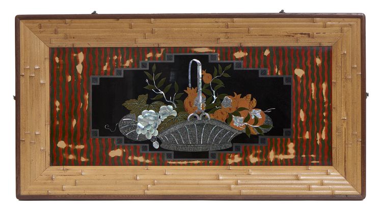A Japanese Lacquer-work panel in a frame made from strips of bamboo