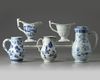 A GROUP OF FIVE CHINESE BLUE AND WHITE AND EN GRISAILLE POURING VESSELS