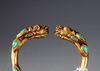 A SINO TIBETAN GILDED BANGLE, 19TH CENTURY