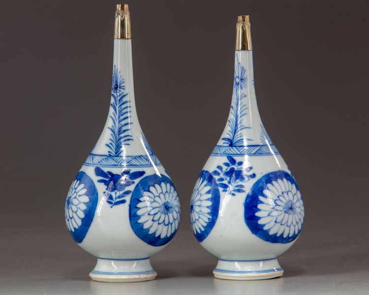 A pair of blue and white rosewater sprinklers