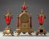 A SPELTER AND RED PORCELAIN CLOCK SET, 19TH CENTURY