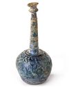 A TALL-NECKED BLUE GLASS BOTTLE, PERSIA OR SYRIA, 11TH-12TH CENTURY