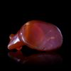 A RECLINING BULL AMULET IN CARNELIAN, EASTERN MEDITERRANEAN, 6TH CENTURY BC