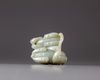 A Chinese celadon jade ‘twin qilin’ carving