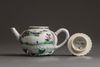 A small Chinese famille rose moulded teapot and cover