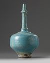 An Islamic turquoise glazed bottle vase