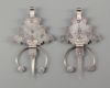 A pair of  mineral inlay fibula's