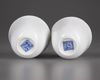 A  PAIR OF SMALL CHINESE WHITE-GLAZED DRAGONS CUPS, 20TH CENTURY