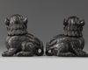 A pair of Chinese carved zitan wood Buddhist lions
