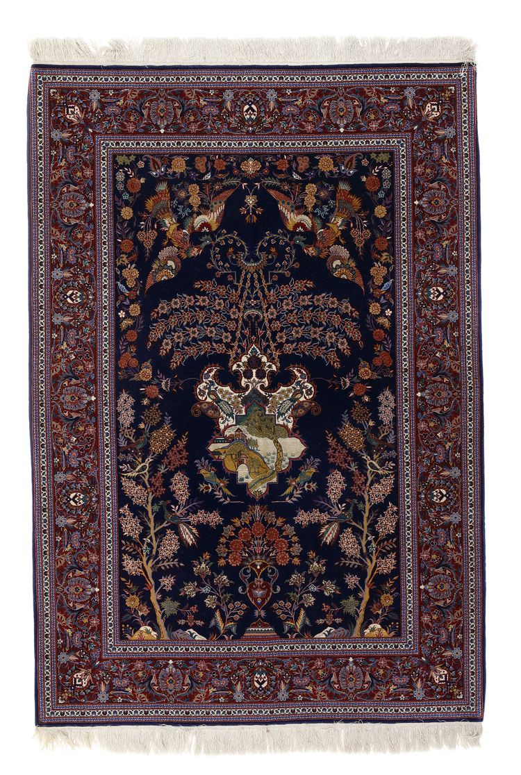 A FINE SILK KASHAN RUG