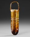 A DOUBLE-TUBE GLASS UNGUENTARIUM WITH APPLIED HANDLE, CIRCA 4TH-5TH CENTURY AD