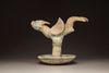 A Chinese green-glazed dragon-carp oil lamp