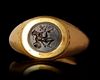 A ROMAN GOLD RING WITH A BLACK JASPER INTAGLIO, 2ND CENTURY BC