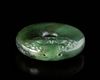 A CHINESE SPINACH JADE CARVED DISC PENDANT, 20TH CENTURY