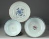 Two Chinese blue and white bowls and a famille rose bowl