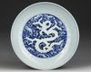 A CHINESE BLUE AND WHITE DRAGON DISH, QING DYNASTY (1644-1911)