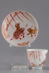 A gilt Chinese cup and saucer